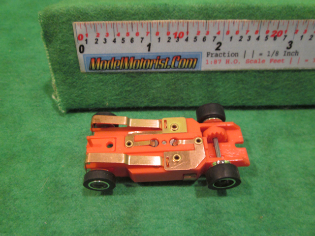 Bottom view of Dash IROC Red (Error) HO Slot Car Chassis