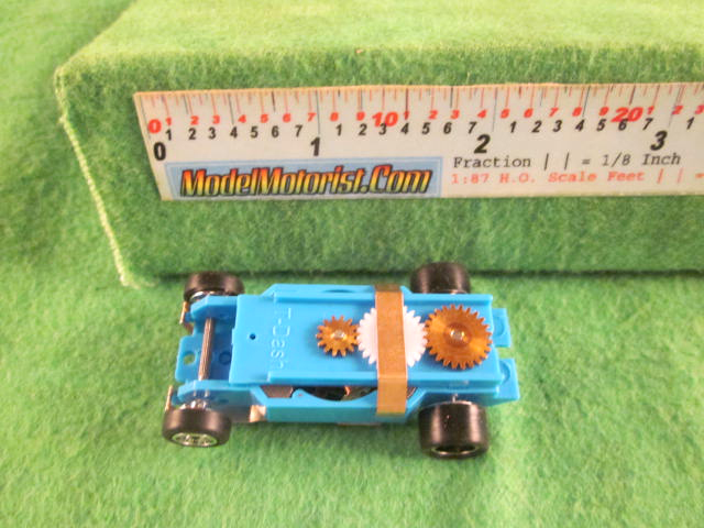Top view of Dash Mondo Grip Light Blue HO Slot Car Chassis