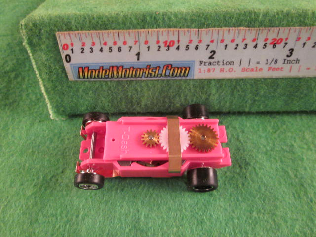 Top view of Dash Mondo Grip Pink HO Slot Car Chassis