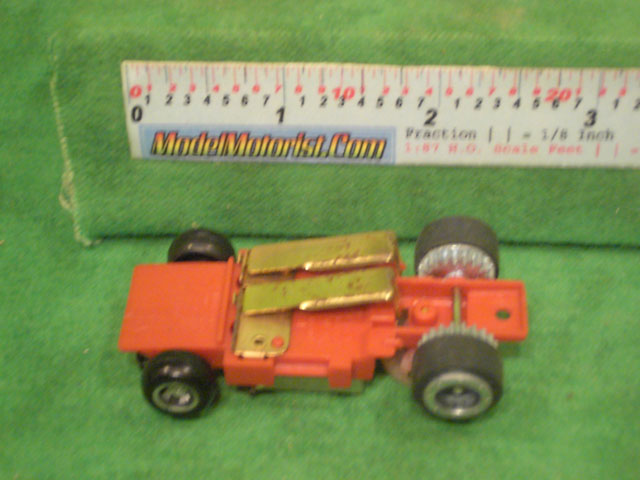 Bottom view of Ideal Passing MK2 Red A HO Slotless Car Chassis